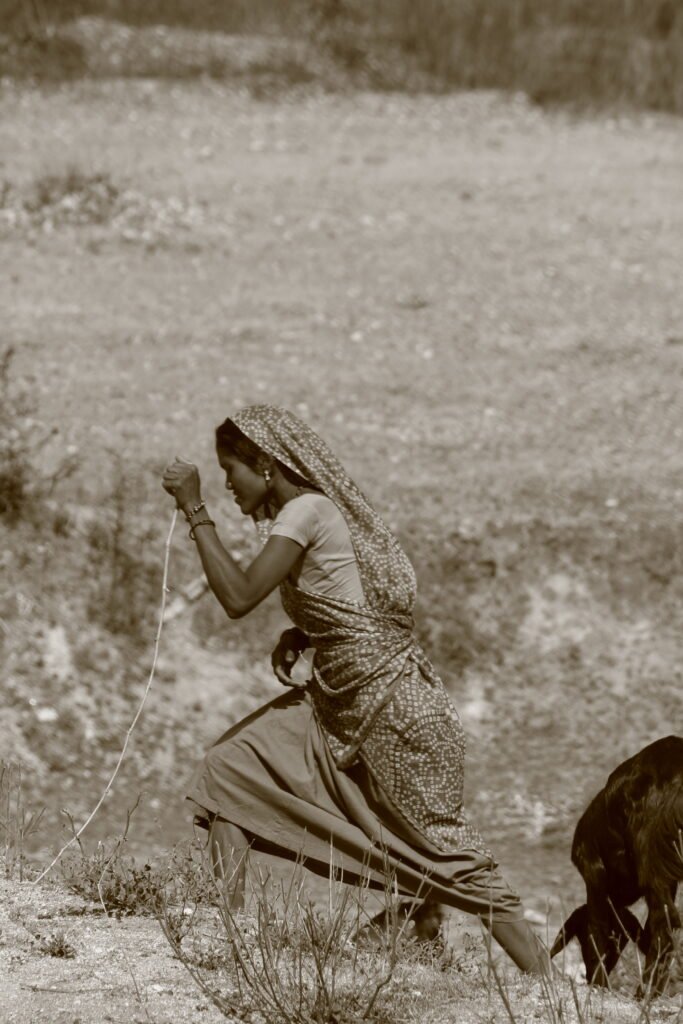 image of a lady working in the fields captured by Jainish Soni